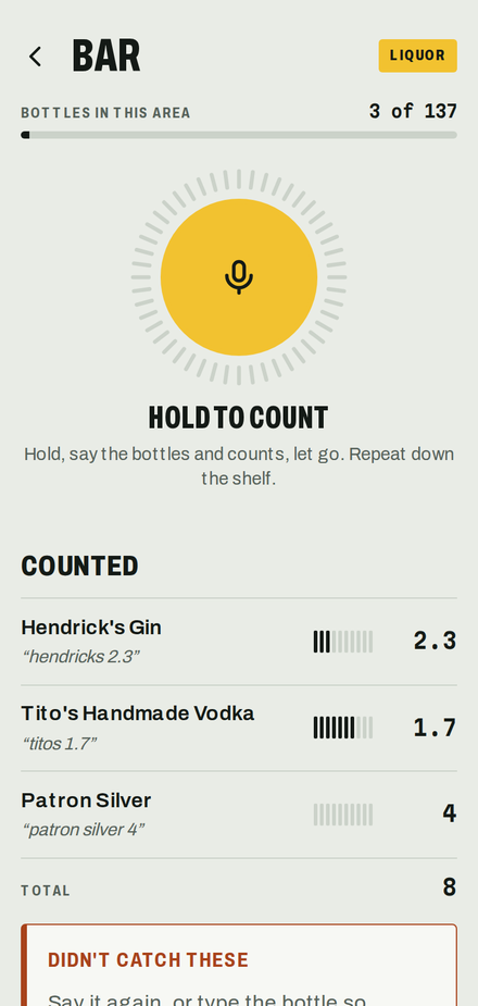 ShelfCall on a phone, mid-count: the yellow mic button above the bottles counted so far